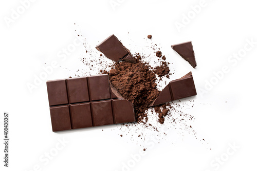 Obraz na plátně Top view of broken dark chocolate bar and chocolate powder  isolated on white ta