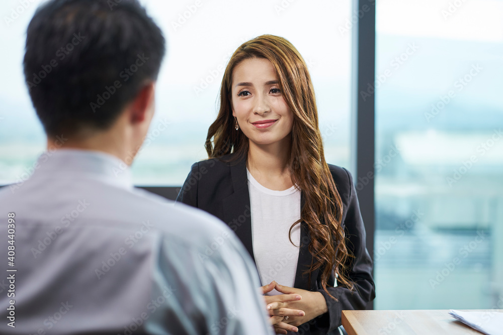 young asian corporate executive interviewed by male HR manager young asian corporate executive interviewed by male HR manager