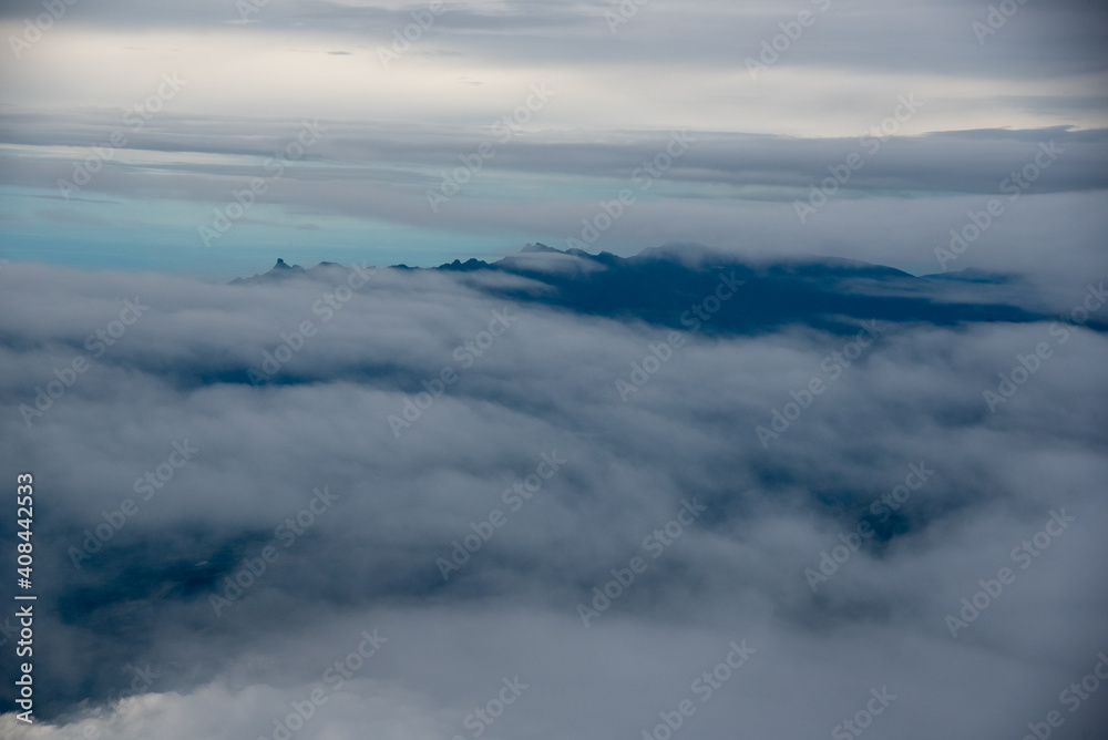 Dawn between fog in mountain ranges of the Colombian Andes