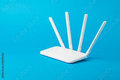 Bilde på lerret Modern stylish Wi-Fi router on a light blue background.