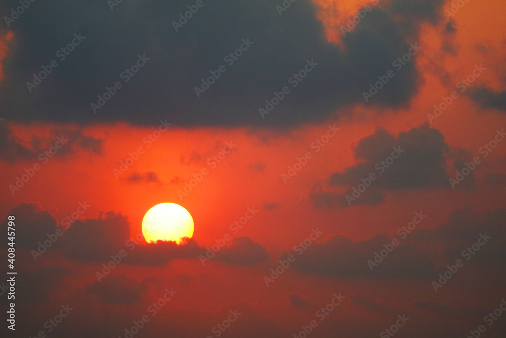 beautiful sunset orange yellow red silhouette gray sky in back on cloud