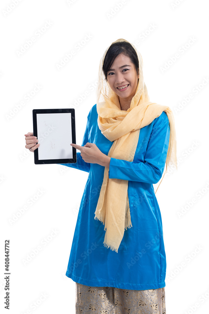 muslim woman showing her tablet pc screen isolated over white muslim woman showing her tablet pc screen isolated over white