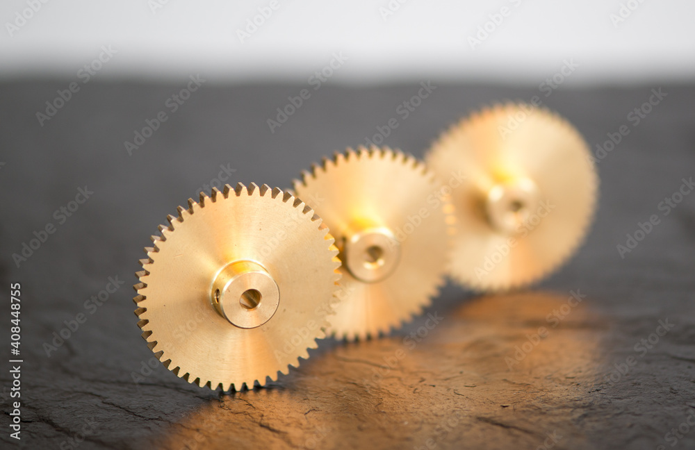Three Brass Wheels On A Slate Platter Three Brass Wheels On A Slate Platter