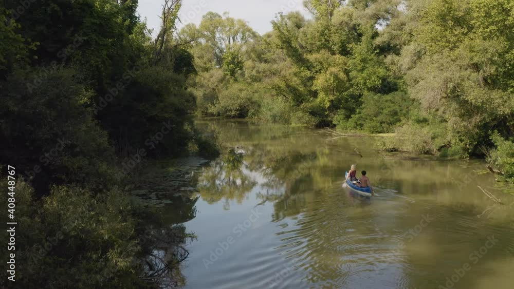 Canoeing insummer sunlight Tisza river passage, Lake Tisza, Hungary Canoeing insummer sunlight Tisza river passage, Lake Tisza, Hungary