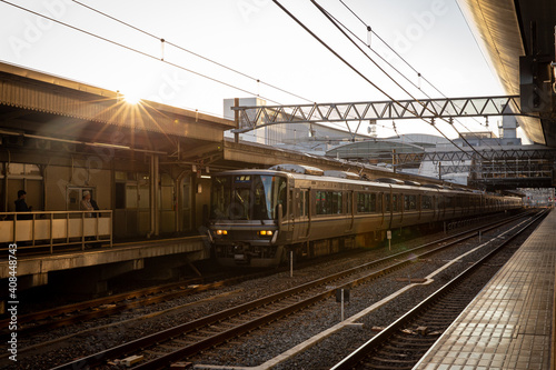 Railway station with modern commuter train in Japan 