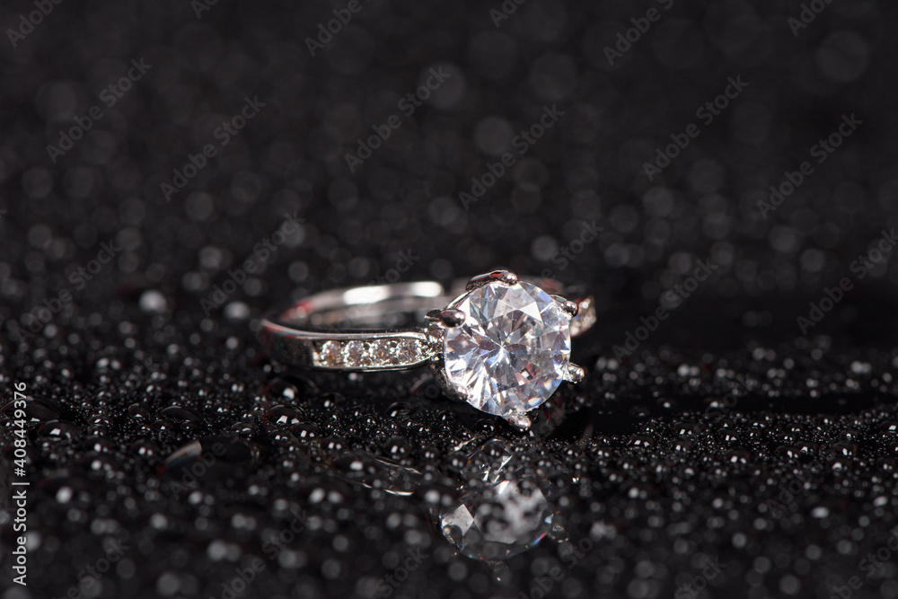 Diamond Ring and drops Isolated on black background Diamond Ring and drops Isolated on black background