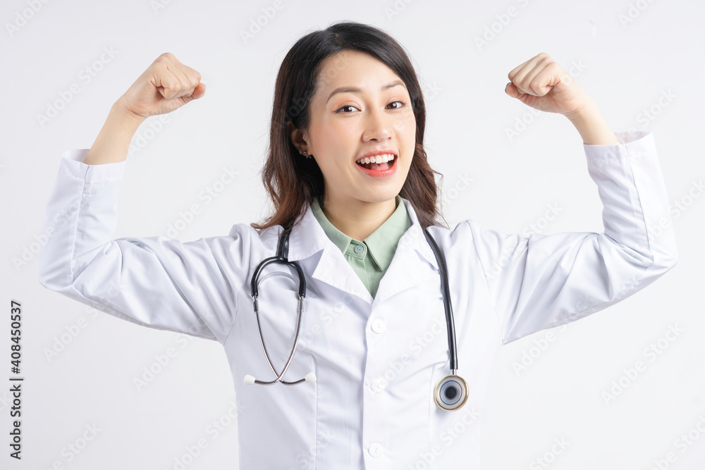 Asian female doctor holding up her hands in a strong shape Asian female doctor holding up her hands in a strong shape