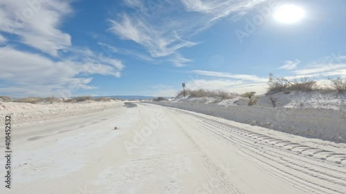 Sandy road meets asphalt at White Sands in New Mexico