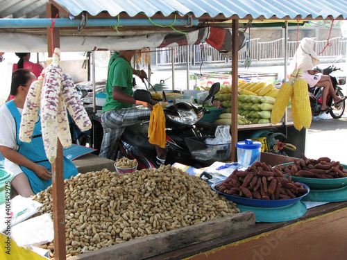 Thai market stall selling corn and nuts. Thailand