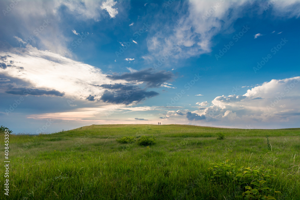 Hilly Landscape With Two Person Far Away Hilly Landscape With Two Person Far Away
