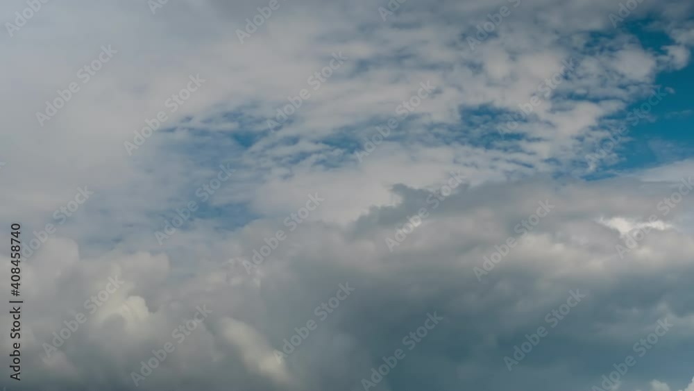 Timelapse - fast moving white clouds against blue sky. Daylight, cloudy day. Nature, freedom, time lapse concept Timelapse - fast moving white clouds against blue sky. Daylight, cloudy day. Nature, freedom, time lapse concept