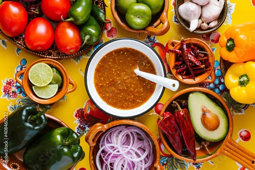 Bild auf Leinwand mexican salsa spicy sauce and ingredients on a table kitchen in Mexico city, Top view copy space