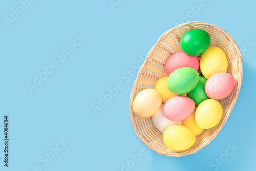 Easter Eggs In Basket. Basket with easter eggs. Close up of colorful Easter eggs in a basket. copy space. top view