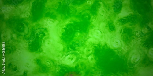green abstract acrylic background with brush strokes and splashes	