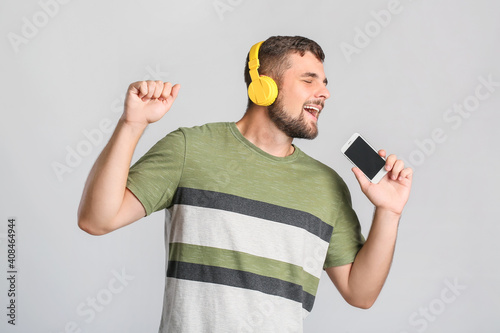 Young man with mobile phone...