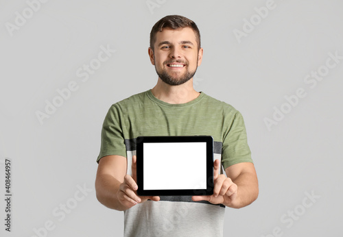 Young man with tablet compu...