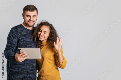 Young couple with tablet co...