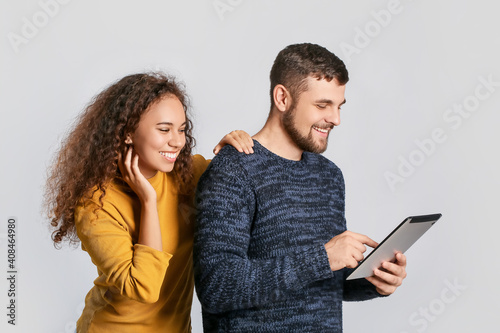 Young couple with tablet co...