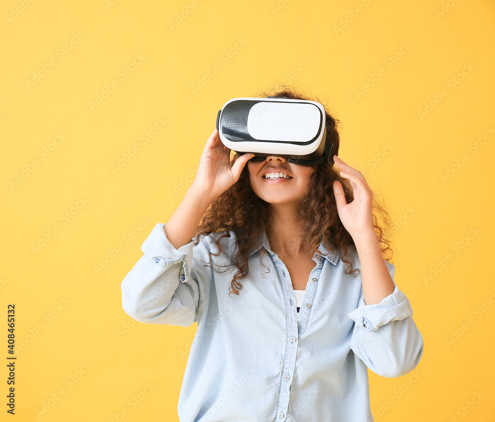Young woman with virtual reality glasses on color background Young woman with virtual reality glasses on color background