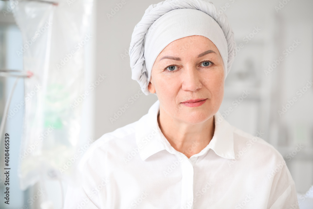 Mature woman undergoing chemical therapy course in clinic Mature woman undergoing chemical therapy course in clinic