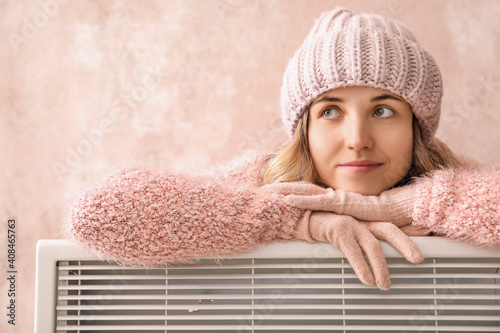 Young woman in warm clothes...