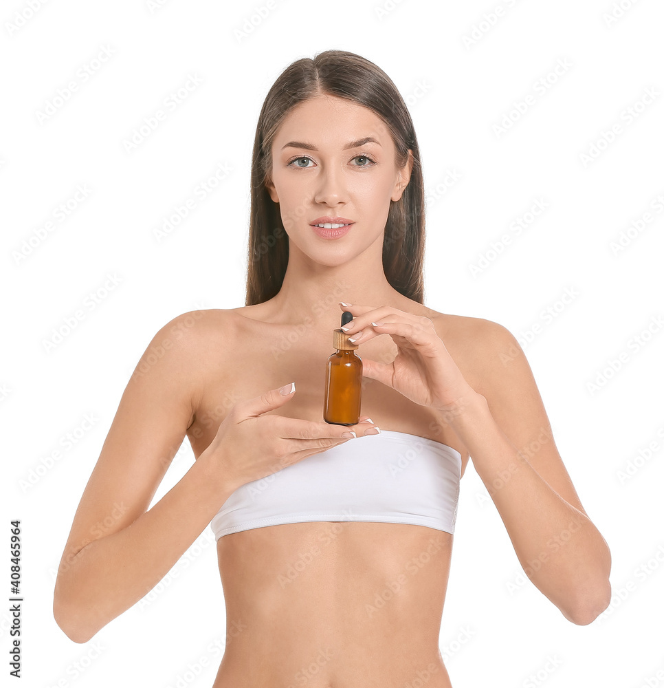 Fototapeta premium Beautiful young woman with cosmetic product on white background