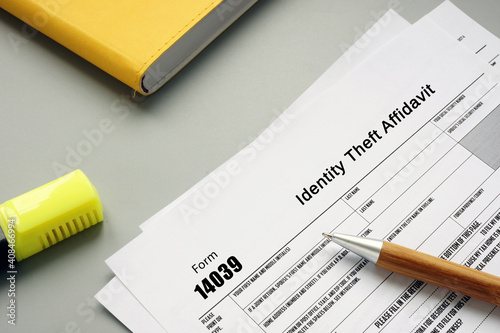  Financial concept about Form 14039 Identity Theft Affidavit with inscription on the sheet.