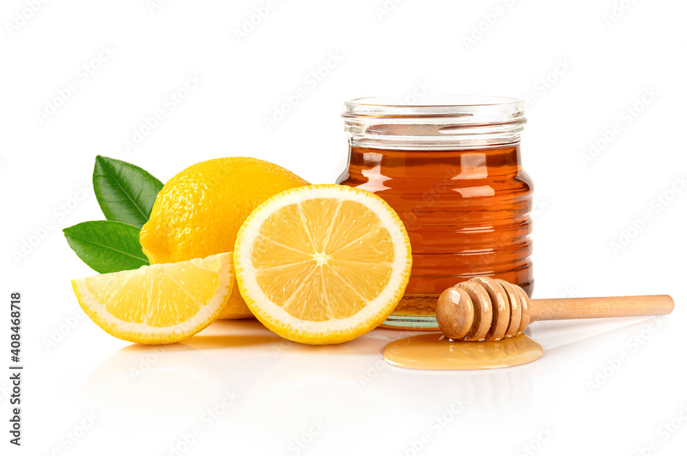 Honey with lemon and leaves on white background. Honey with lemon and leaves on white background.