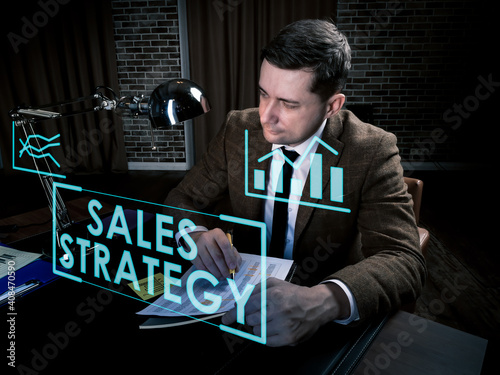 Sales strategy info concept. Man works late at the table.