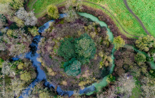 Looking down at an 11th century motte-and-bailey earth fortification in Suffolk, UK photo