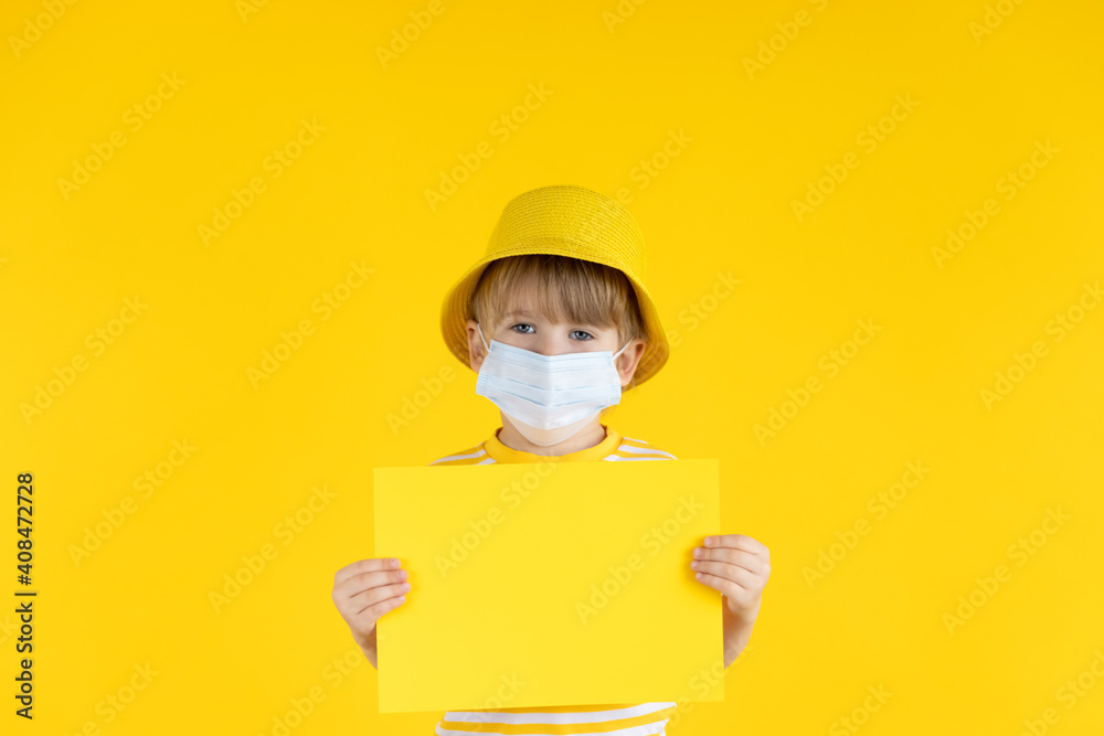 Portrait of kid wearing protective mask against yellow background Portrait of kid wearing protective mask against yellow background