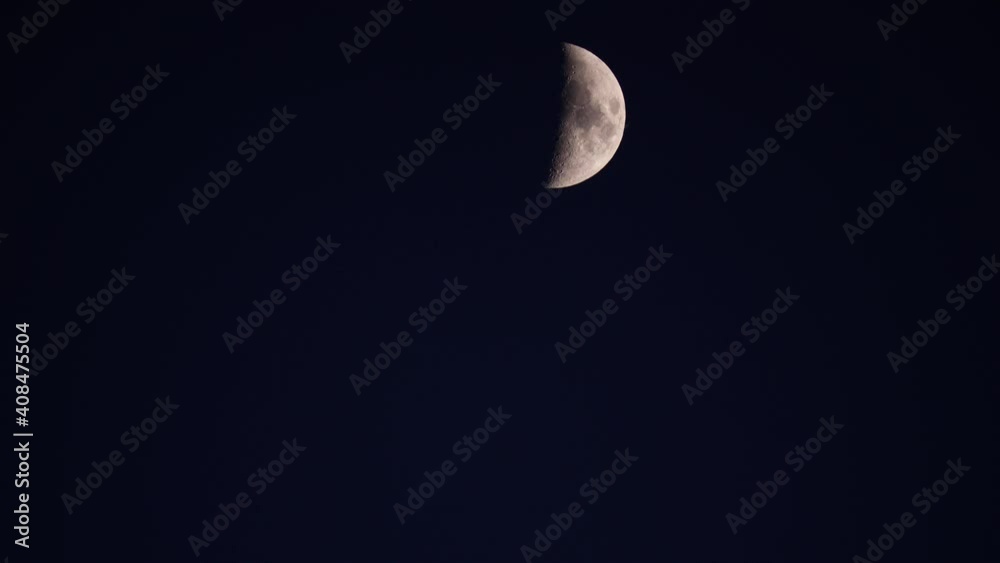 Half moon at night on black sky, moonlight. Half moon at night on black sky, moonlight.