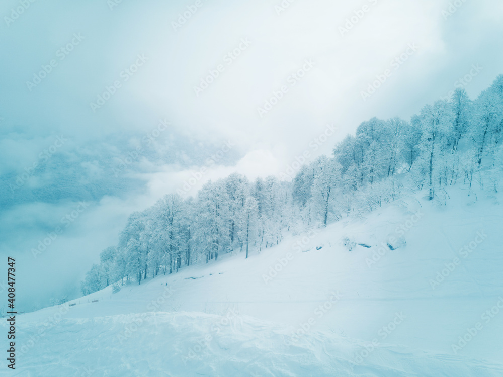 Ski slope in winter mountains