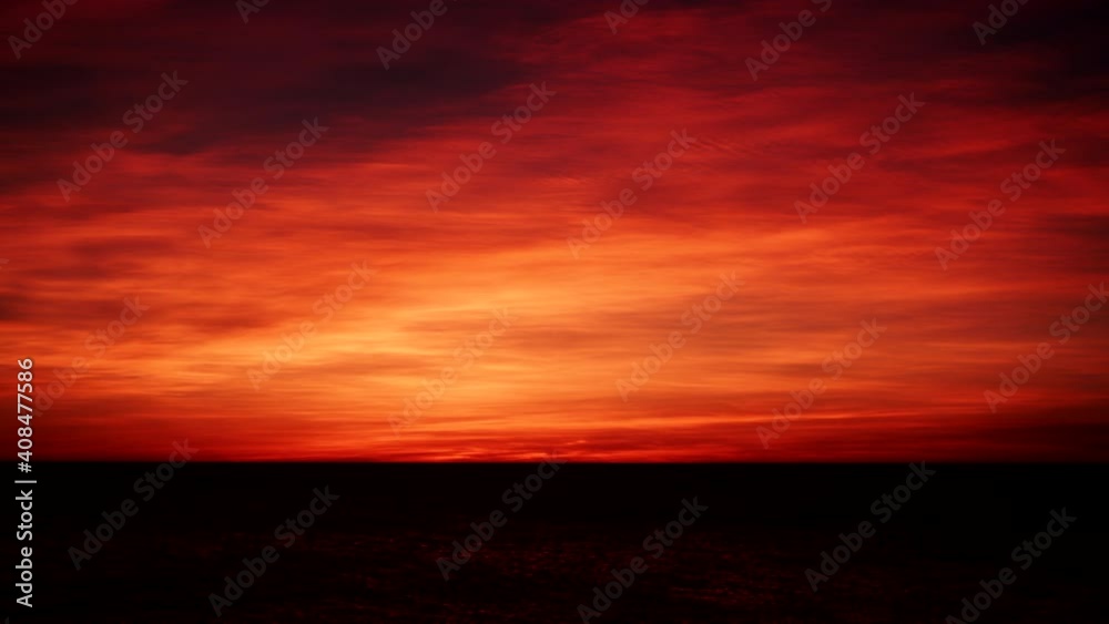 Red burning sunrise sky, early morning. Nature landscape. Time lapse Red burning sunrise sky, early morning. Nature landscape. Time lapse