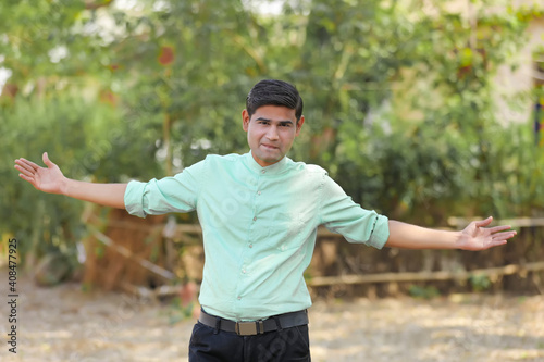 Young handsome indian man giving expression