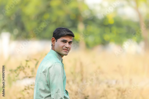 Young handsome indian man giving expression