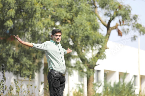 Young indian man Jump in air after achieving success.