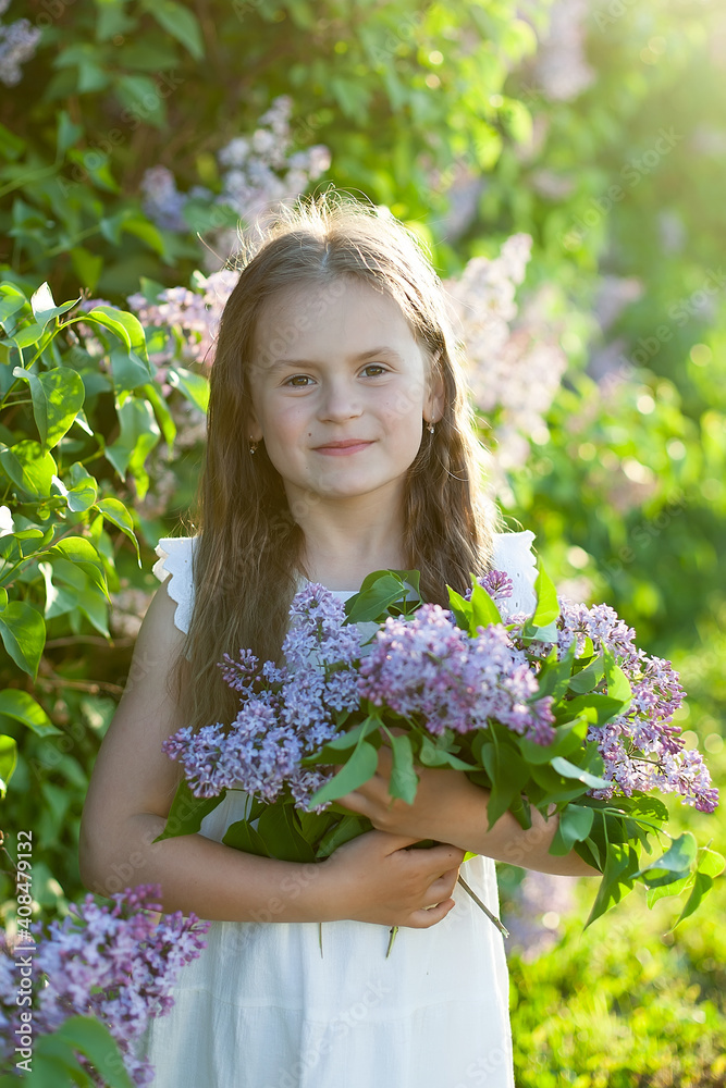 Young spring girl in spring garden. Young lady feeling happy in nature. Facial portrait of funny teenager girl. Young spring girl in spring garden. Young lady feeling happy in nature. Facial portrait of funny teenager girl.