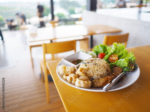 ried rice with notrhern Thai spicy sausage and fresh vegetables photo