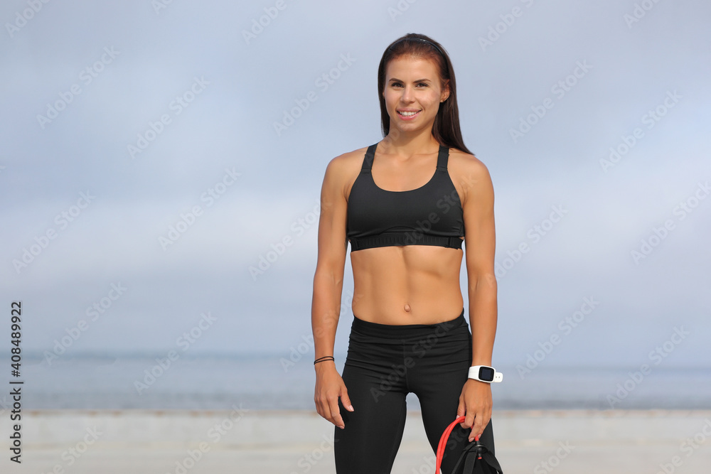 Fototapeta premium young sports woman by the sea