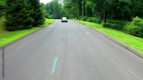 Following Behind the James Bond Aston Martin DB5 Sports Car Driving photo