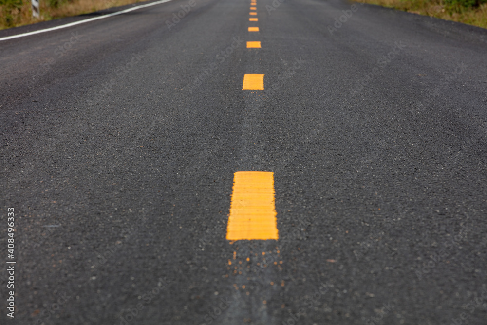 The road surface that is marking a new lane. (background,texture)