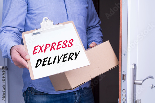 person delivers package to home. Friendly worker, high quality delivery service photo