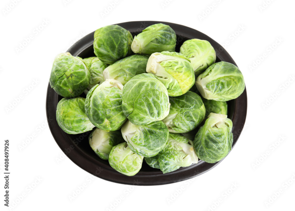 Fototapeta premium Fresh Brussels sprouts in bowl isolated on white, top view