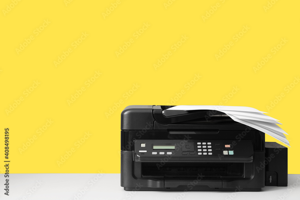 New modern printer with paper on yellow background. Space for text New modern printer with paper on yellow background. Space for text
