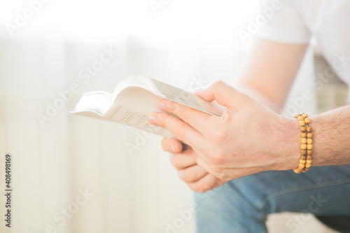 The Christian holds the Bible in his hands. Reading the bible. The concept of faith  spirituality and religion