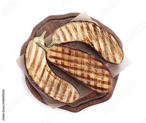 Serving board with delicious grilled eggplant halves isolated on white, top view