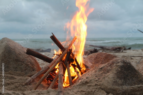 campfire with sea beach background in evening storm season 