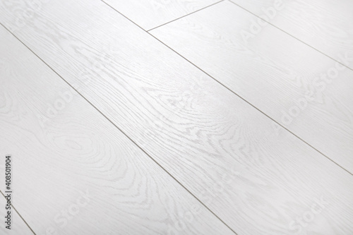 Light wooden laminate as background. Floor covering