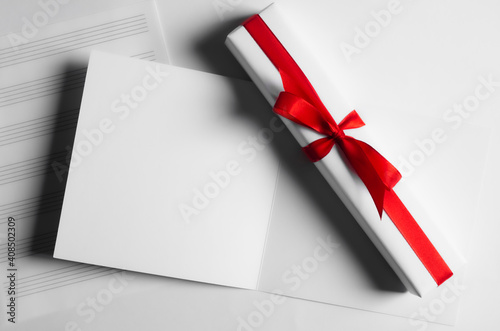 Postcard and gift box with red ribbon on white background.14 February Valentine's day.Copy space.